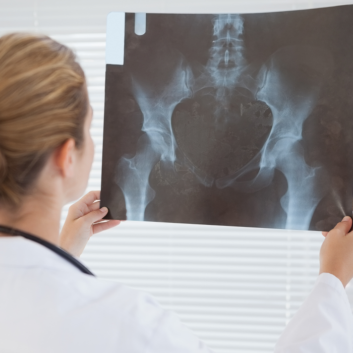 pregnant-woman-looking-at-ultrasound-shots-of-her-2024-11-03-00-42-39-utc 1